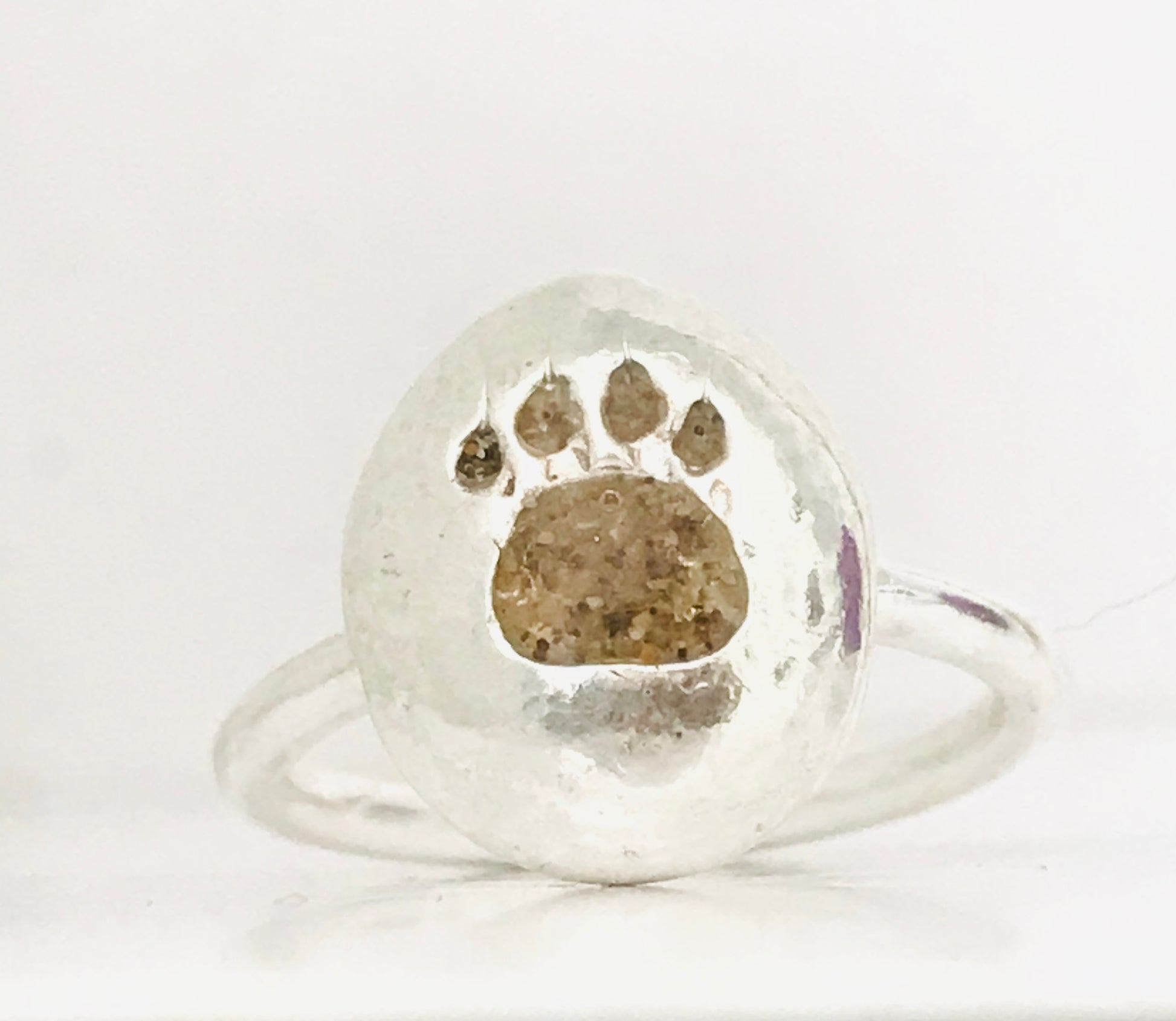 Paw print pebble ring with Gower sand inlay.