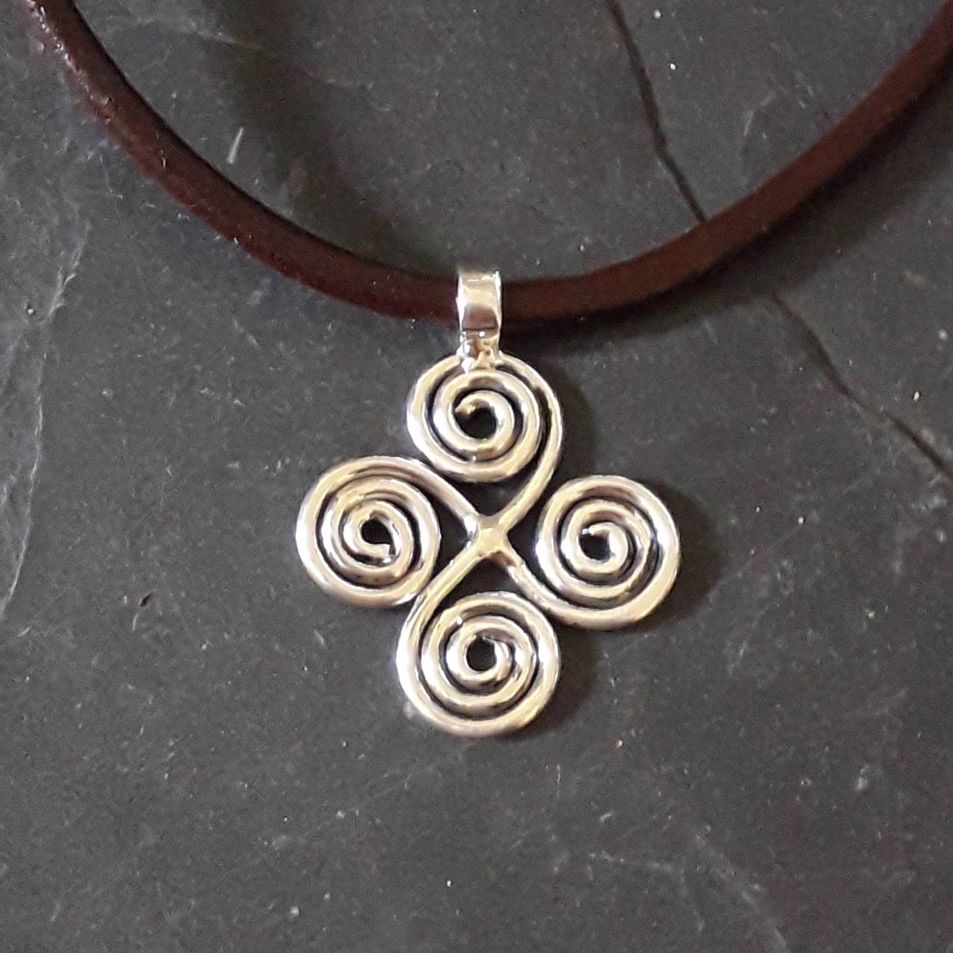 Celtic silver pendant on brown leather
