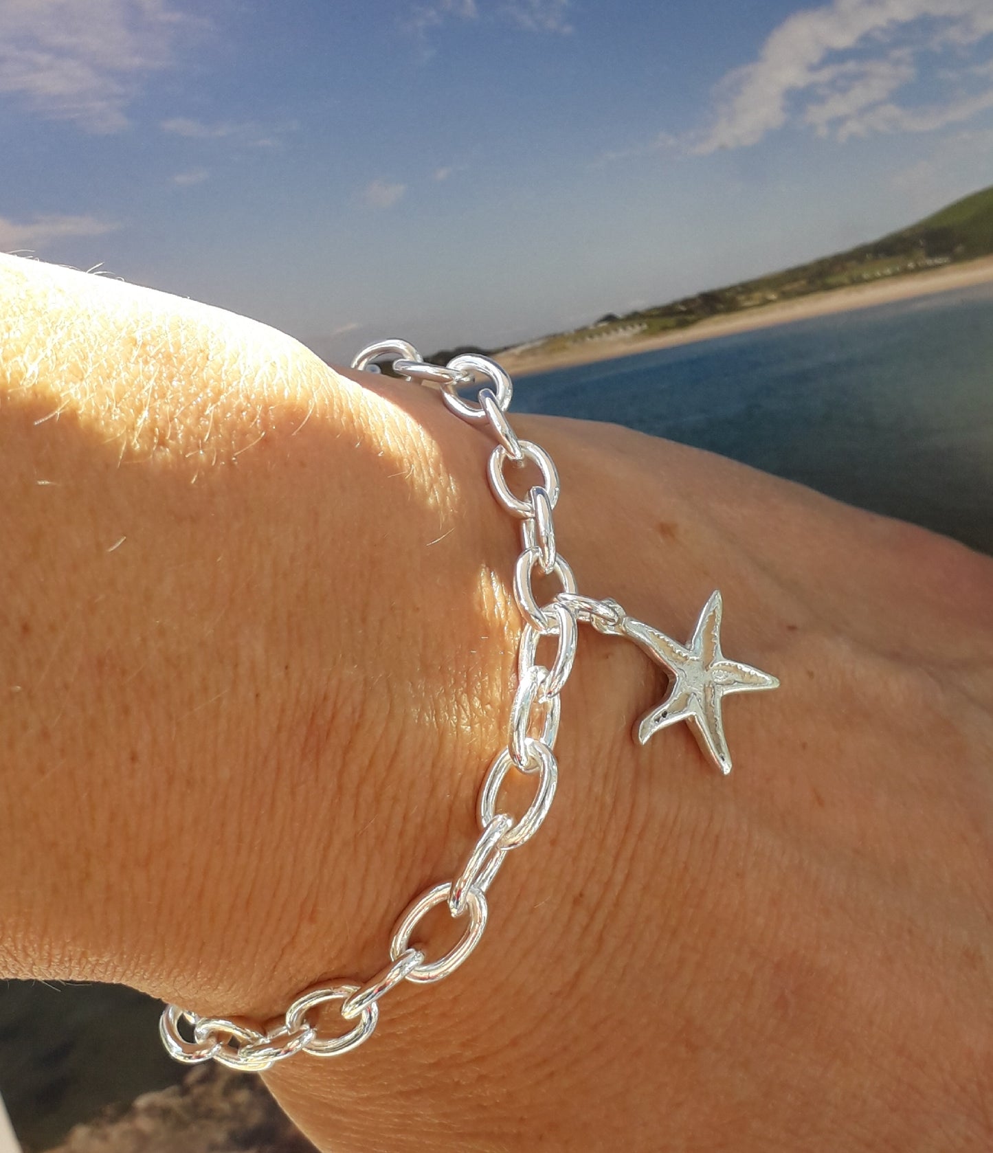 Silver charm bracelet with starfish