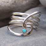 Silver barrelling wave and opal ring by Pa-pa jewellery